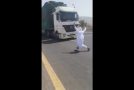 Crazy Dude With Deathwish Jumps In Front of an Oncoming Semi Truck