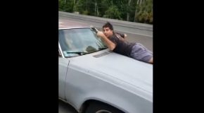 Driver Notices Man on the Hood of Car and Gets a Thumbs-Up and a Casual Request: “Call the Cops”
