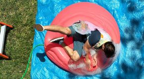 Falling Onto a Giant Water Balloon in Slow Motion