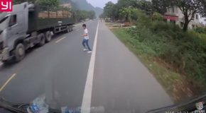 Two Trucks Avoid Clueless Pedestrian