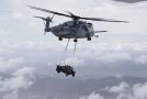 Military Chopper Refuels During Flight as Humvee Swings Precariously Below It