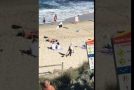 Uncooperative Child Dragged Along Beach