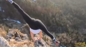Crazy Girl Does Yoga In Tight Pants On A Perilous Rock
