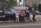 20 People Help Flip SUV to Free Those Trapped Inside