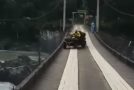 ATV Rider Hits Bump On Bridge Gets Thrown Into Rapids Below
