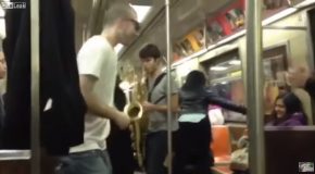 Two Random Strangers Have A Saxophone Battle On NYC Subway!