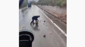 Good Samaritan Stops Car And Removes Rocks That Landed On The Road!