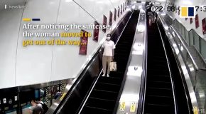 Suitcase Left On An Escalator Hits A Woman And Knocks Her Over