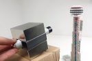 Taking Down A CN Tower Of Magnetic Balls With A Magnet Cannon