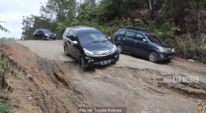 Cars Struggling To Drive Over A Bad Patch Of Road
