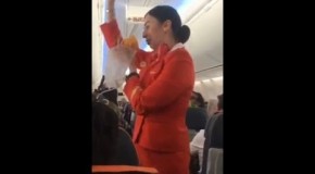Irish football fans distract air hostess during safety demonstration.