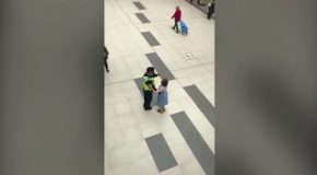 Heart-warming moment police officer dances with an elderly lady in a shopping centre