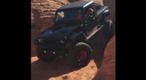 A Rear Steering Jeep Wrangler Driving Straight Down a Vertical Cliff Wall
