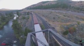 A Drone Performing Amazing Looping Tricks Above Trains