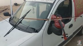 A Truck Plays the Violin With a Bow Attached Its Moving Windshield Wipers