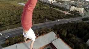 Guy Performs Impressive Handstand On Rooftop