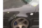 Low Riding Car With Flat Tire