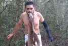 Man Hangs Six Snakes From Mouth While Standing on Spikes!