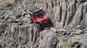 Red Jeep Traverses Across Sketchy Trail