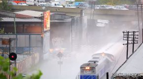Train Plows Through Waterlogged Tracks, Sprays Everyone With Water