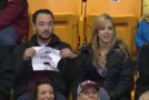 Guy Pulls Out Hilarious Sign When Put Under The Kiss Cam!