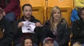 Guy Pulls Out Hilarious Sign When Put Under The Kiss Cam!