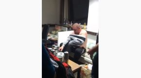 Extremely Drunk Guy Tries To Put On A Pair Of Pants Instead Of A Shirt!
