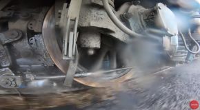 Satisfying Footage Of Train Wheels Driving And Splashing Through Water