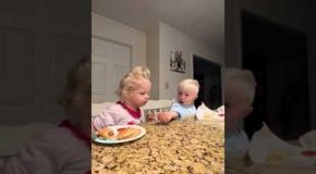 Good Big Brother Teaches His Little Sister How To Eat Properly And Shares His Food