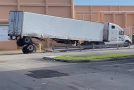 Semi-Truck Tries To Drive Around Safety Barriers, Ends Up Losing Its Back Wheels