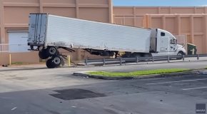 Semi-Truck Tries To Drive Around Safety Barriers, Ends Up Losing Its Back Wheels