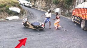 Scooter rider falls on a steep mountain road