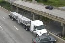 Driver cuts off a semi truck, gets what he deserves