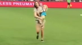 Two-year-old kid runs onto a football field, and his mom tackles him
