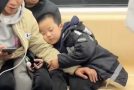 Good students in a subway help a sleepy boy find his father