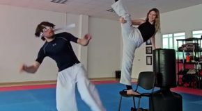 Person ends up hitting their partner during a blindfolded taekwondo high kick