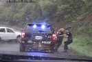 Policeman saves fellow cop from an oncoming car