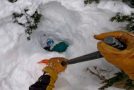 Snowboarder stuck under loose snow gets rescued by a stranger