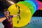 Testing how many balloons it takes to stop a compound bow and arrow
