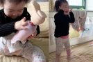 Reaction of a 2-year-old girl putting on a prosthetic leg by herself for the first time
