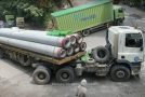 Trucks driving up a very steep and tight mountain road