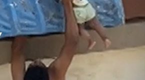 Baby dangling from a roof in India gets rescued