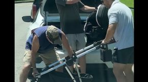 Group of dads try hard to collapse a baby stroller