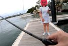 Man throws a fish back after fishing, woman threatens to call the cops on him