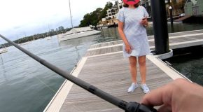 Man throws a fish back after fishing, woman threatens to call the cops on him