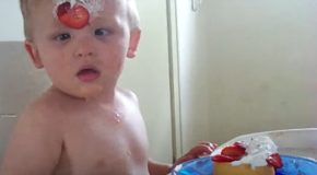 Sleepy toddler faceplants into a strawberry shortcake