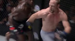 Brock Larson literally runs away from Melvin Manhoef during a match