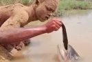 Amazing hand-fishing technique displayed by a boy