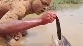 Amazing hand-fishing technique displayed by a boy